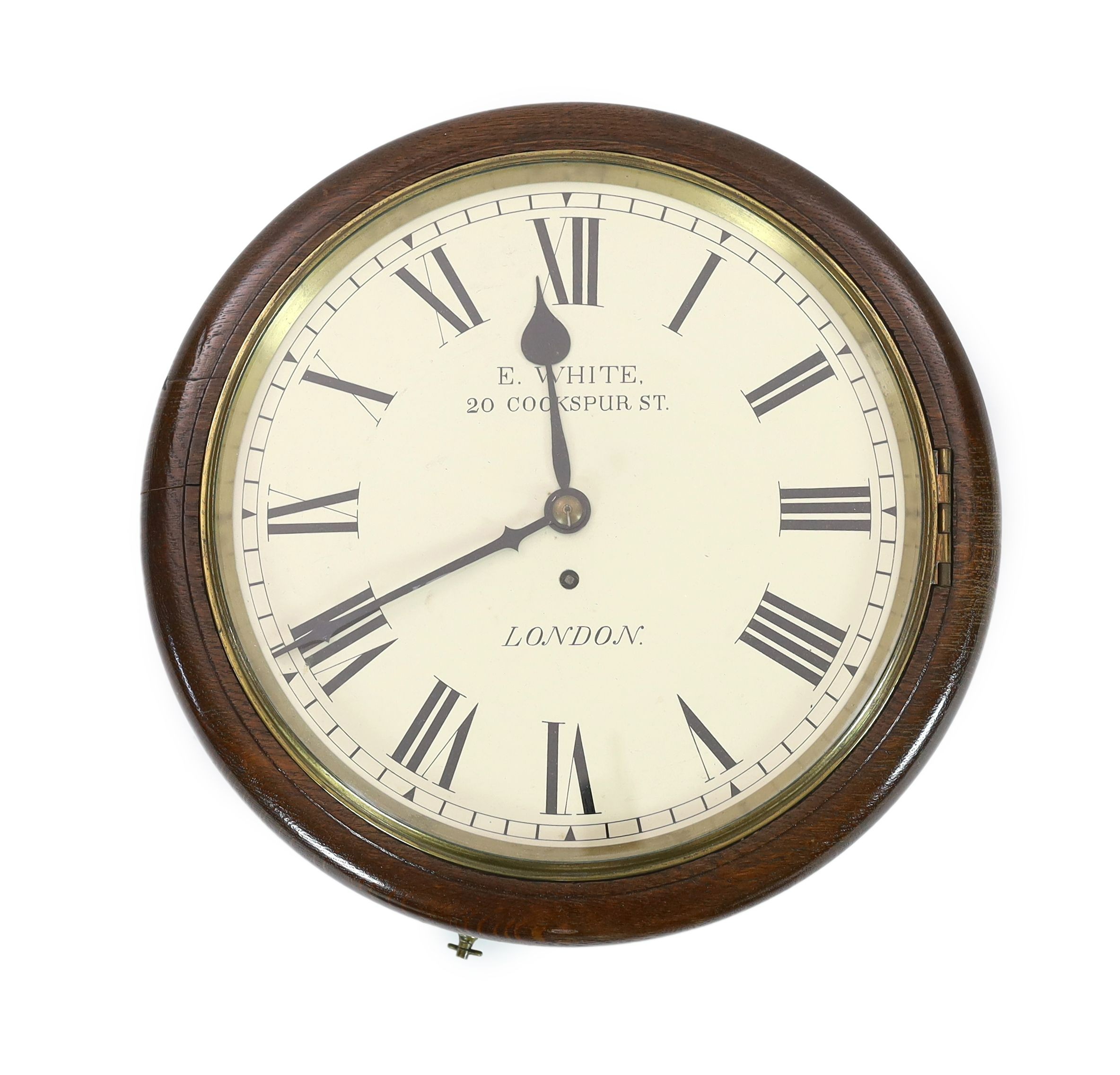 E. White, 20 Cockspur Street, London. A late Victorian oak cased wall timepiece, diameter 38cm